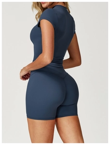 Detail of navy blue brushed yoga top showing ergonomic fit and seamless back design