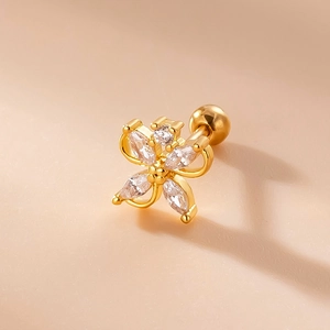 Macro shot of gold butterfly stud earring with marquise cut stones and ball back screw