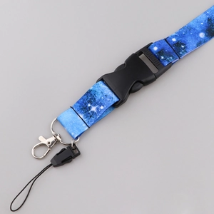 Detail showing starry galaxy print lanyard with plastic buckle and metal swivel hook