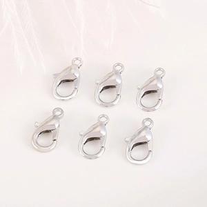 Silver alloy lobster clasp connectors for DIY jewelry making with white feather background