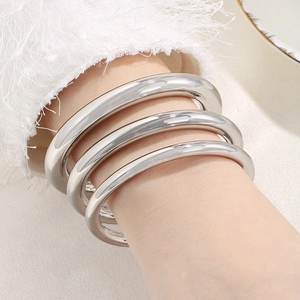 Three-piece set of minimalist polished silver stainless steel chunky bangle bracelets