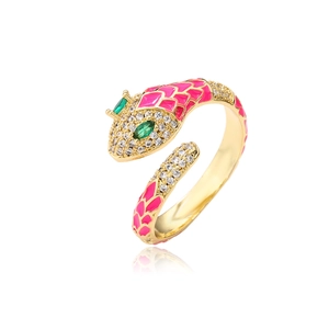 Detail of gold snake ring with pink enamel scales and sparkling green gemstone eyes