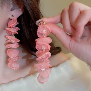 Detail of pink floral tassel earrings with mesh petals and sparkling crystal beads