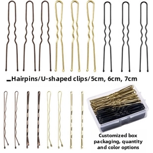 Detail of 5-7cm U-shaped and bobby pins in black, gold, and brown with storage box