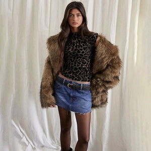 Chic leopard print top paired with brown faux fur jacket and denim skirt set