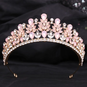 Macro detail of silver tiara with pink teardrop crystals and white rhinestones