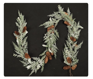 Close-up of frosted green pine needles and natural pine cones for Christmas decoration