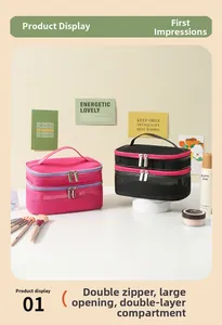Detail view of double-layer mesh cosmetic bag with dual zippers and partition storage