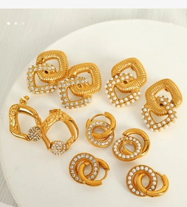 Detailed view of hollow geometric gold earrings with rhinestones and faux pearls