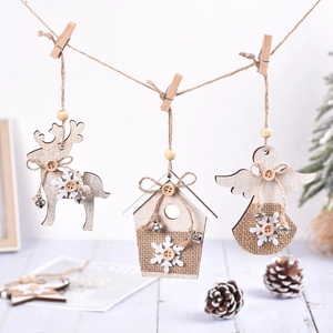 Wooden Christmas ornaments set featuring reindeer, house and angel shapes with rustic bells