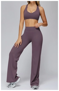 Detail of purple two-piece yoga set with racerback bra and high-waisted flared pants