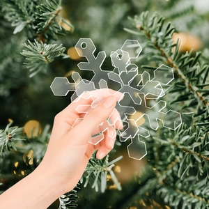 Close-up of clear acrylic snowflake ornament with pre-drilled hole for Christmas decor