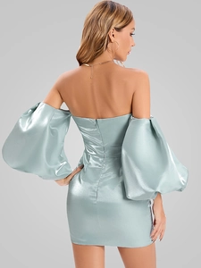Rear view of sleek satin off-shoulder dress featuring lantern sleeves and zipper detail