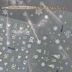 Goldene Weihnachts-Nagelaufkleber mit Schneeflocken und Motiven auf MO-418 Nagelstickern