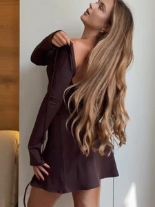 Detail of deep brown long sleeve dress with slim fit waist and backless cutout design