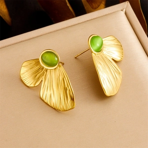 Vintage gold butterfly set with green cat eye stone necklace and earrings displayed