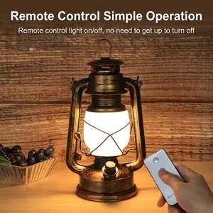 Retro LED lantern with remote control in bronze finish on a rustic wooden table