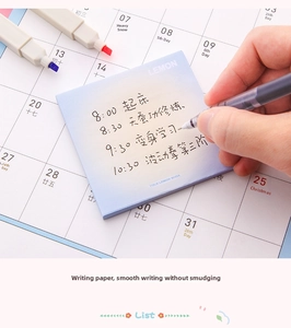 Macro shot of blue gradient sticky note on calendar with smooth writing surface