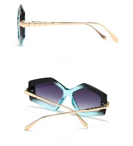 Detail view of square gradient lenses and gold metal temples with textured joints