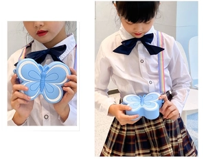 Detail of blue butterfly silicone crossbody bag with adjustable rainbow strap for kids