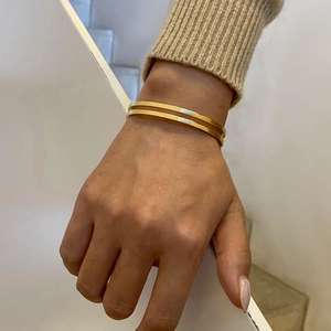 Detailed view of 18k gold plated stainless steel double-layered open cuff bracelet
