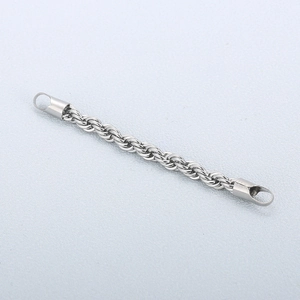 Polished silver stainless steel twist rope chain bracelet on a light grey background