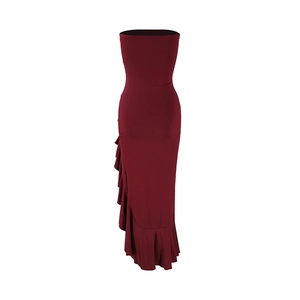 Detail of burgundy tube dress featuring elegant ruffles and a stylish side slit design
