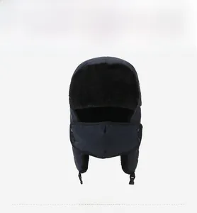 Close-up of winter trapper hat with navy windproof fabric and black faux fur lining