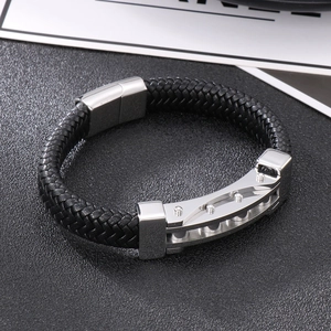 Macro view of braided black leather bracelet with polished silver magnetic metal clasp