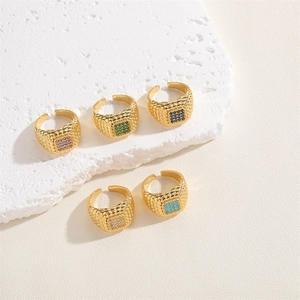 Artistic layout of five gold adjustable rings with colorful square zircon gemstones