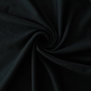 Detailed macro shot of silky black elastic fabric with elegant texture and glossy finish