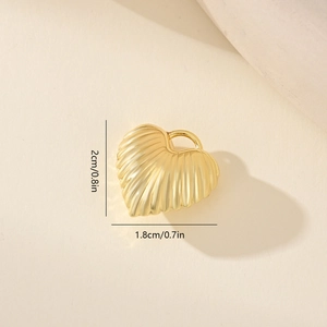 Detailed view of a gold heart pendant with wrinkled texture including size measurements