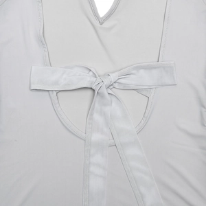 Close-up of the silver-grey dress featuring an elegant back tie knot and cut-out detail