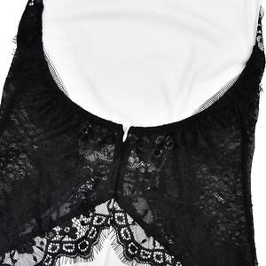 Detail of elegant black floral lace splicing on white dress neckline with lash trim