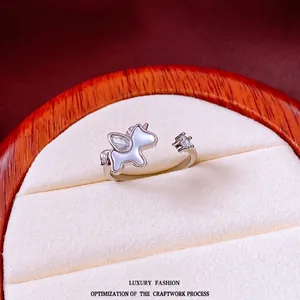 Adjustable silver unicorn ring with mother of pearl inlay and drop shaped zircon stones