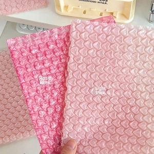 Close-up of heart-shaped bubble wrap in rose pink and light pink for gift packaging