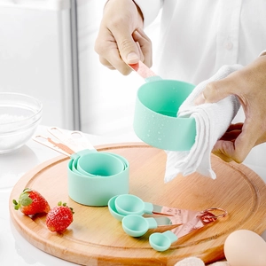 8-piece mint green and rose gold measuring cup and spoon set for kitchen baking