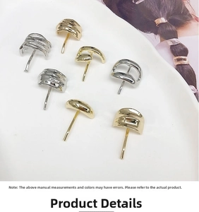 Detail view of minimalist gold and silver metal hair hooks in various geometric wavy shapes