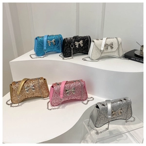 Multi-color glitter chain bags with metallic bow clasps and curved base design