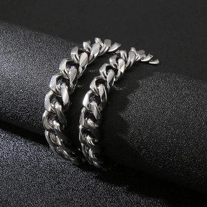 Bold silver titanium steel Cuban link bracelet with polished finish and metallic luster