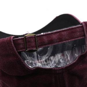 Detail of adjustable vintage bronze buckle on burgundy washed cotton baseball cap