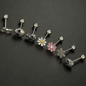 Detailed collection of skull, flower and text engraved stainless steel tongue piercings