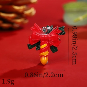 Macro detail of Christmas resin candle charm with size 0.98x0.86in and 1.9g weight