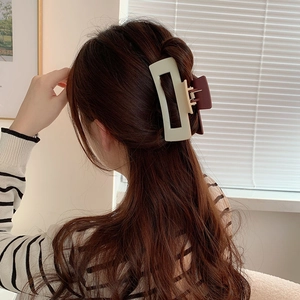 Matte two-tone oversized hair claw clip in beige and coffee for elegant updos