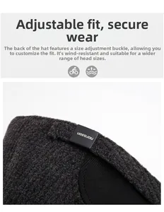 Detail of adjustable metal buckle and warm knit texture on dark grey winter baseball cap