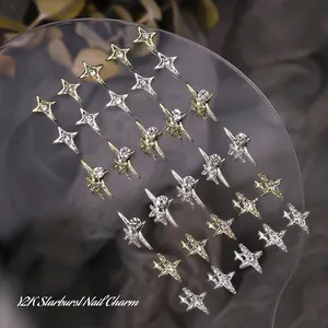 Y2K starburst nail charms with gold and silver glitter studs on acrylic board