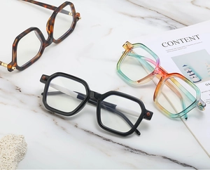 Close-up of tortoise shell and gradient sunglasses on marble with luxury aesthetic