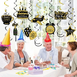 Elegant black and gold retirement party swirl decorations with festive hanging paper cutouts