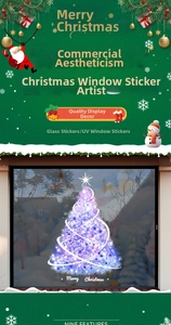 Detail of purple glowing Christmas tree window sticker with Merry Christmas typography