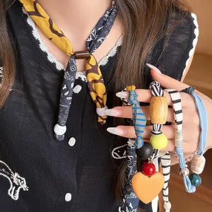 Bohemian printed fabric heart necklace with wooden beads in various ethnic patterns